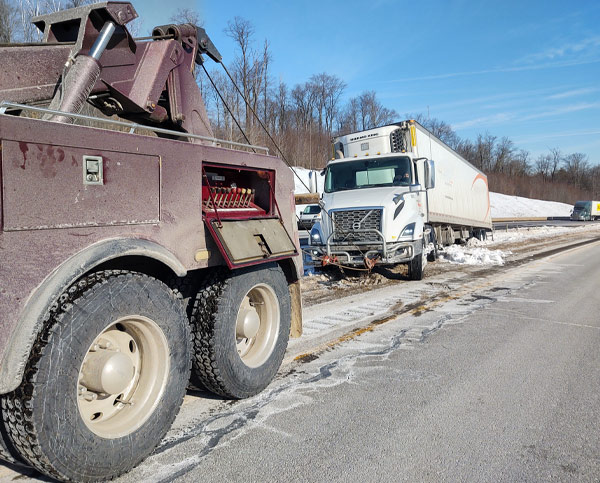 Crosskeys Towing and Road Service Mansfield Pennsylvania Tow Truck Winching Tractor Trailer on highway