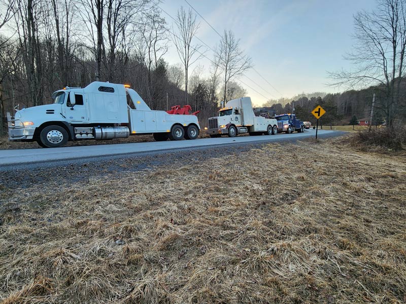 Heavy Duty Tow Trucks in a row at accident recovery scene mansfield pennsylvania